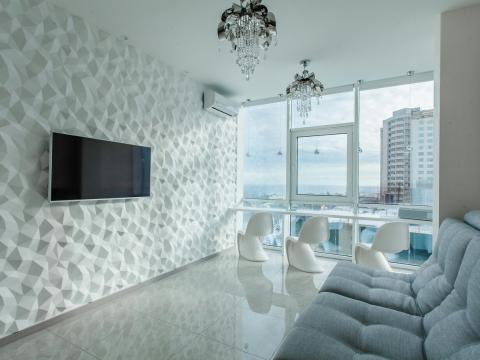 3d панель на всю стену и по центру подвешен телевизор